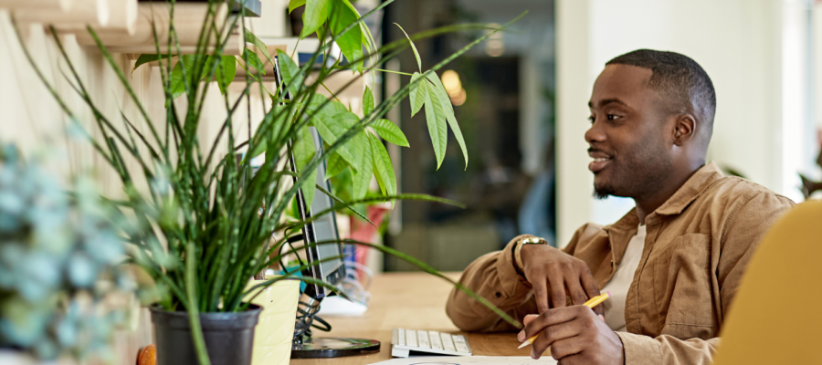 man learning in green office space