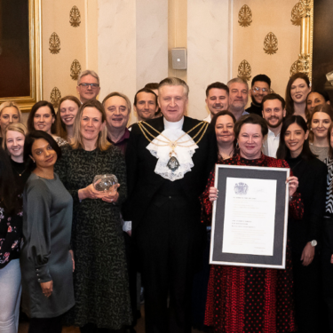 Queens award presentation team photo