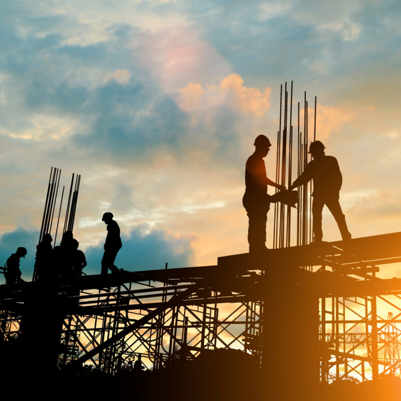 Silhouette,Of,Engineer,And,Construction,Team,Working,At,Site,Over