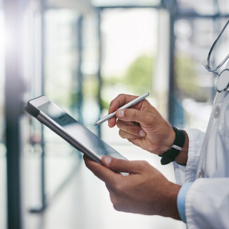 doctor holding tablet