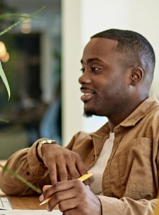 man learning in green office space